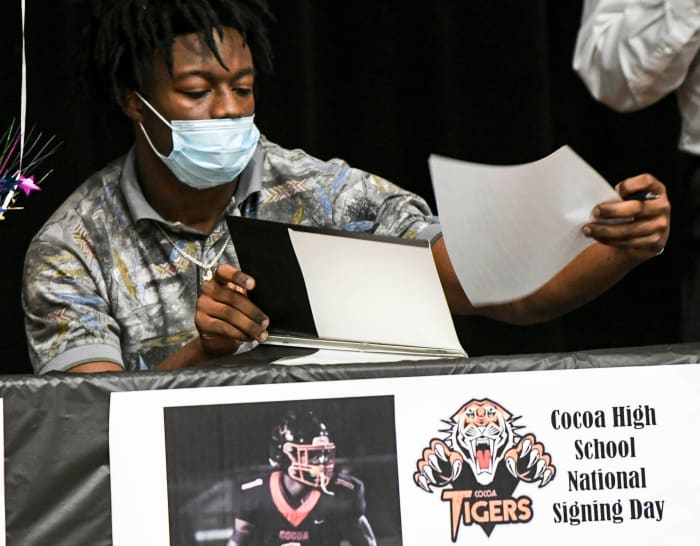 Kionte Curry signs his letter of intent during Signing Day at Cocoa High School on Feb. 3, 2021.